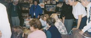 Helen Lindsay signing a copy of Written on the Knee